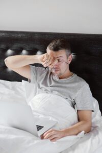 man tired after 8 hours of sleep